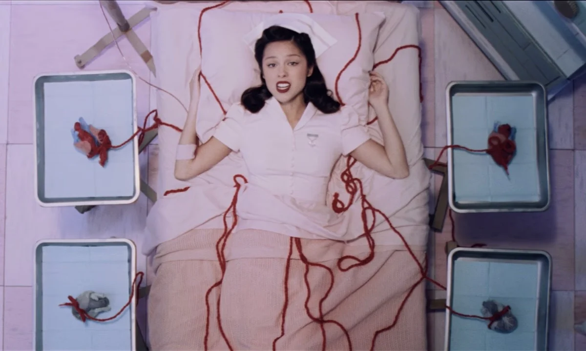 Olivia Rodrigo Channels Frida Kahlo’s Surrealist Vision in Haunting "the cure" Music Video