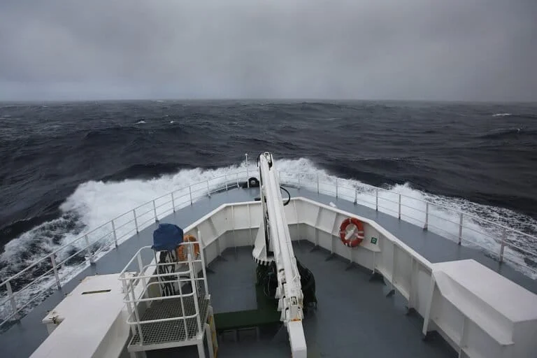 The Global Reach of the Southern Ocean: How Antarctic Storms Shape Waves Thousands of Kilometers Away